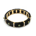 Load image into Gallery viewer, Natural Emerald Round Cabs and Black Onyx Carving 14K gold bangle on-hand view - NFJSD-1128
